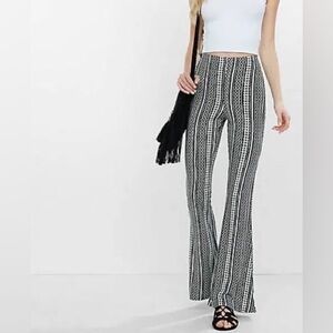 Express black and white patterned flared leggings